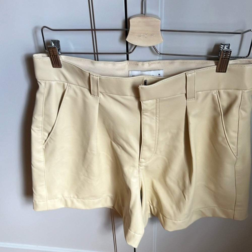 Vegan leather shorts in butter yellow colour